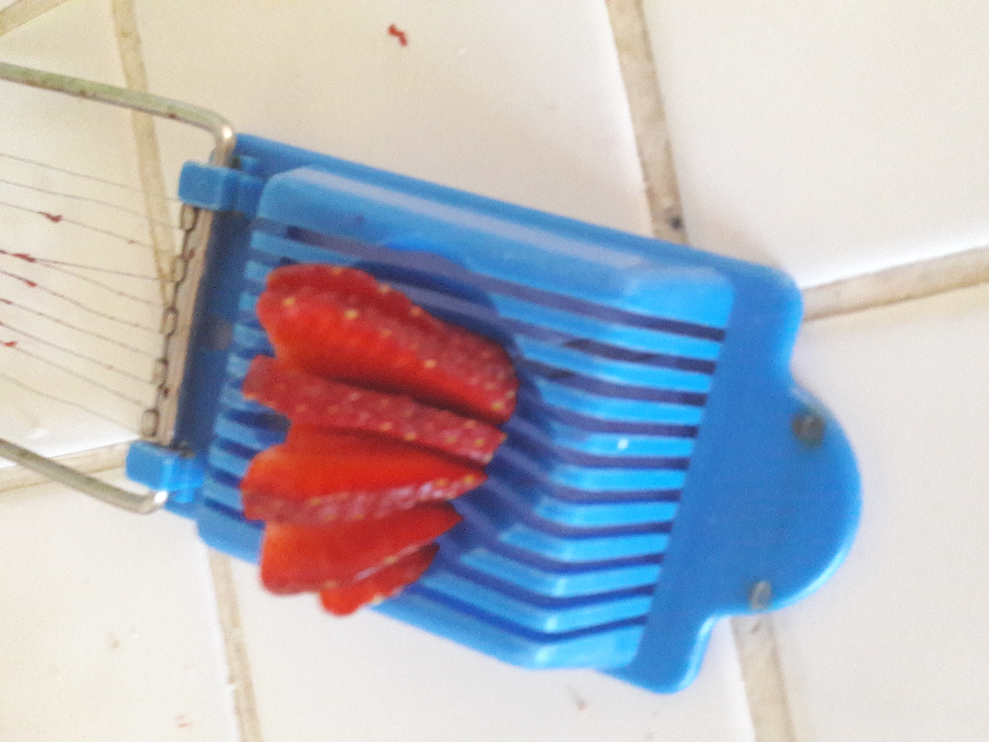 Picture of strawberries being sliced