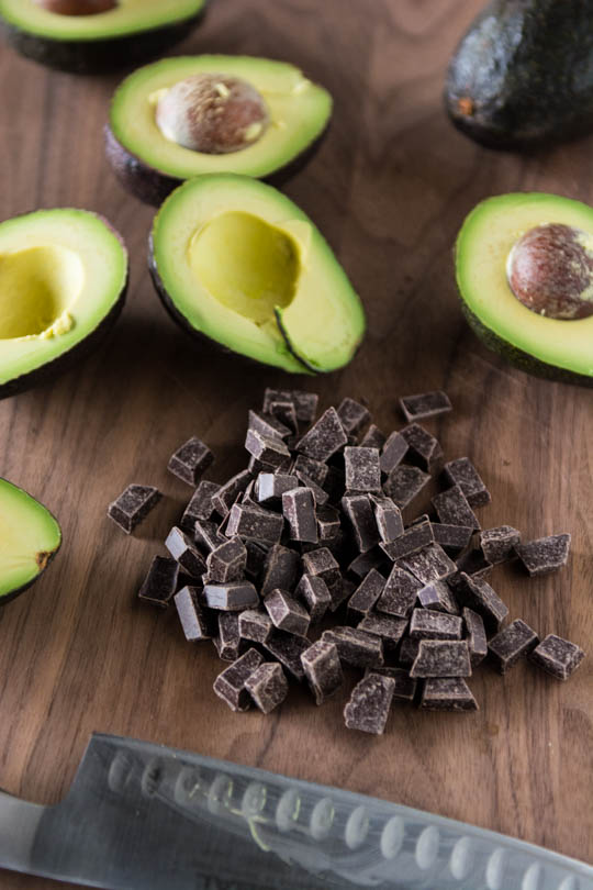 chocolate and avocados on chopping board
